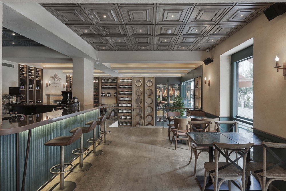 08-slasharchitects-milanogourmet- ceiling-bar-table-chair.jpg