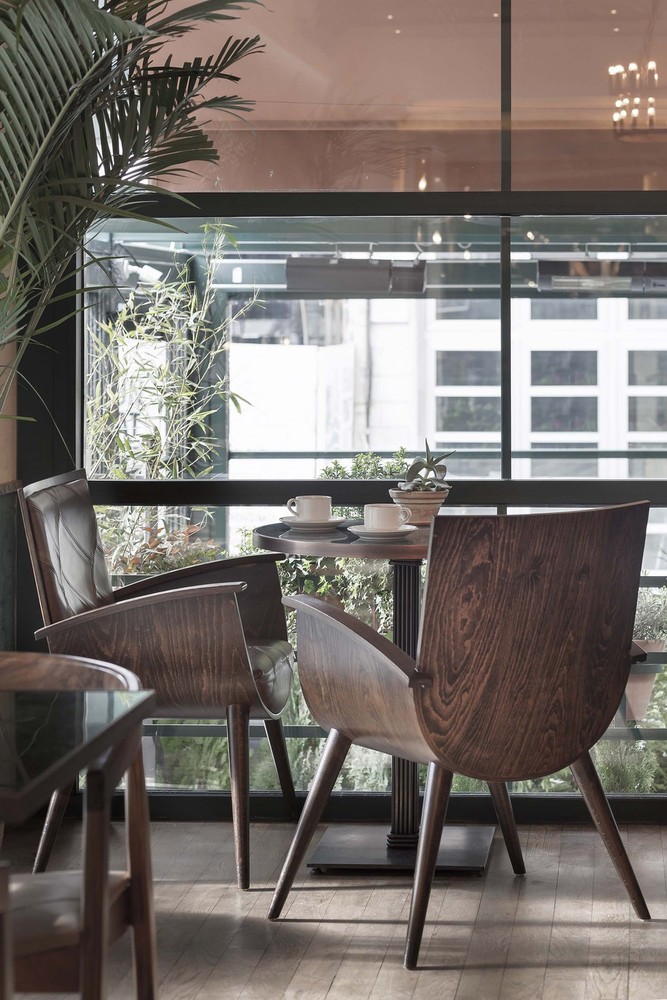 12-slasharchitects-milanogourmet- wood-coffee-corner-green.jpg