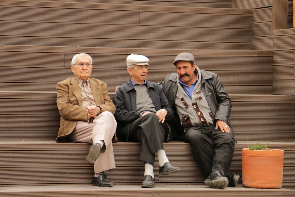 22-HAMAMYOLU URBAN DECK-local people sitting on the amphi-roof.JPG