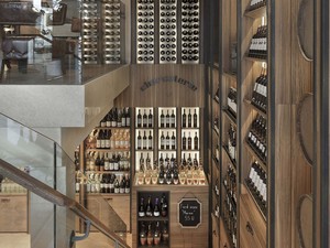 05-slasharchitects-milanogourmet- wine-room-charcuterie-graphic-atrium.jpg