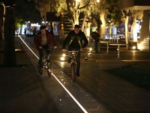 14-HAMAMYOLU URBAN DECK-bicycle riders finding their way on led light beam axis.jpg